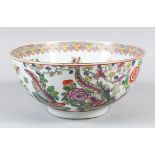 A CHINESE FAMILLE ROSE PORCELAIN BOWL, decorated with scenes of native flora and birds, seal mark to