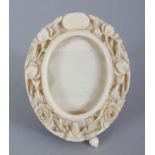 A SMALLER 19TH CENTURY CHINESE CANTON IVORY OVAL PICTURE FRAME, 6.1cm x 5