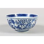 A CHINESE BLUE AND WHITE PORCELAIN BOWL, decorated with butterflies, birds amongst flora, 6cm