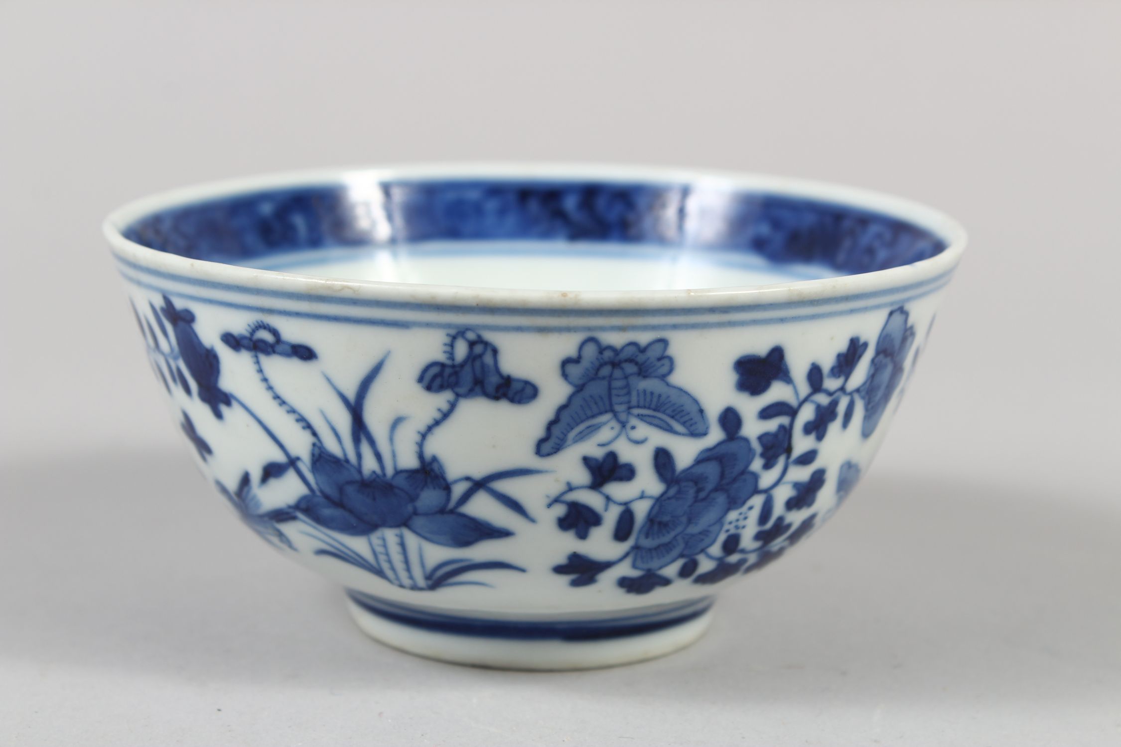 A CHINESE BLUE AND WHITE PORCELAIN BOWL, decorated with butterflies, birds amongst flora, 6cm - Image 2 of 7