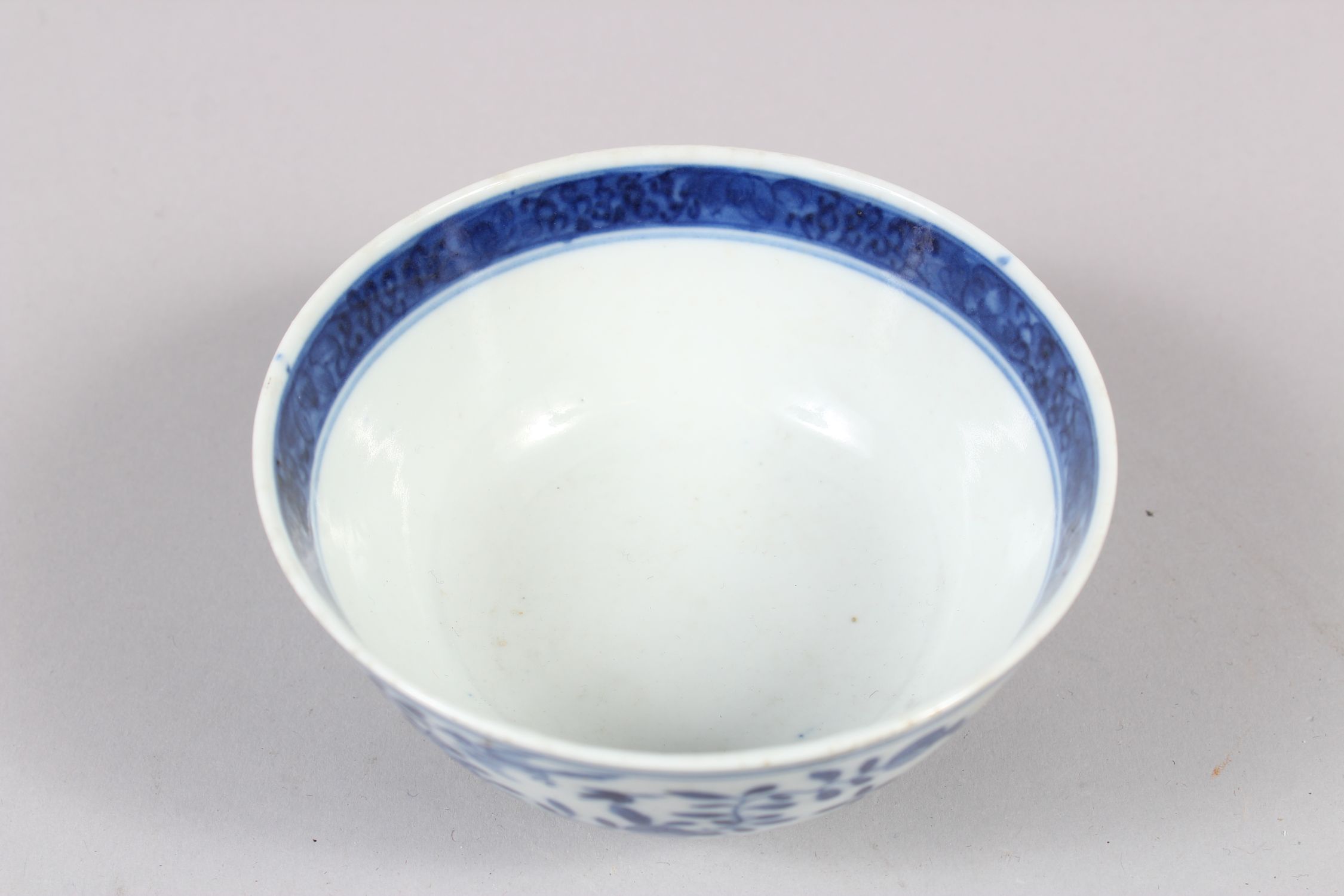 A CHINESE BLUE AND WHITE PORCELAIN BOWL, decorated with butterflies, birds amongst flora, 6cm - Image 5 of 7