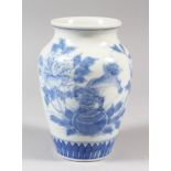 A JAPANESE BLUE AND WHITE PORCELAIN VASE, decorated with scenes of flora, butterflies and a Shi