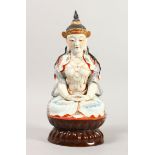 A CHINESE PORCELAIN FIGURE OF BUDDHA, depicted seated with hand and legs crossed, seal mark to the