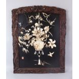 A FINE QUALITY JAPANESE LACQUER AND SHIBAYAMA PANEL IN A HARDWOOD FRAME, the frame carved as dragons