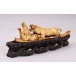 AN 18TH CENTURY INDIAN CARVED IVORY GROUP OF A TIGER & STAG, the tiger attacking the stag, later