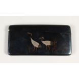 A JAPANESE SHAKUDO AND MIXED METAL CARD CASE, decorated with cranes amidst reeds, artist signed to