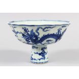 A CHINESE BLUE AND WHITE STEM BOWL WITH A PETAL RIM, painted dragon decoration, Six-character