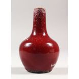 A SMALL 18TH/19TH CENTURY CHINESE FLAMBE BOTTLE VASE, the streaked red glaze turning to purple at