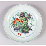 A CHINESE POLYCHROME ENAMEL PORCELAIN DISH, decorated with scenes of flowers and fruit in baskets,