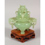 A 20TH CENTURY CHINESE CELADON GREEN BOWENITE TRIPOD CENSER & COVER, together with a fitted wood