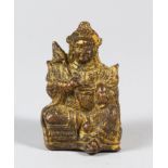 A CHINESE GILT BRONZE STATUETTE OF DEITY, 6.5cm high.