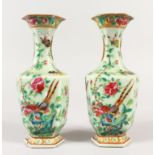 A SMALL PAIR OF 19TH CENTURY CHINESE CANTON CELADON GROUND PORCELAIN VASES, 18.4cm high.