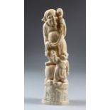 A JAPANESE ONE-PIECE IVORY OKIMONO GROUP OF DAIKOKU AND BOY, Daikoku stood on a barrel, holding