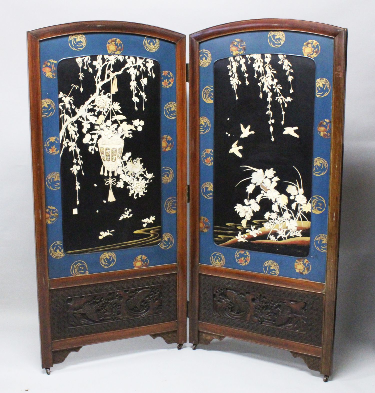 A LARGE JAPANESE MEIJI PERIOD TWO-FOLD HARDWOOD & SHIBAYAMA SCREEN, the panels decorated in high