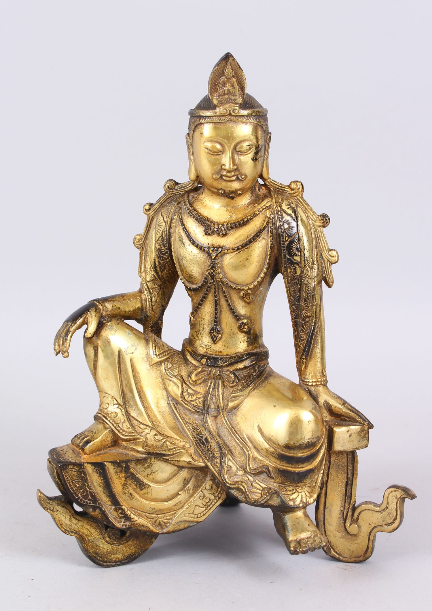 A CHINESE GILDED BRONZE SEATED BUDDHA. 24cm high.