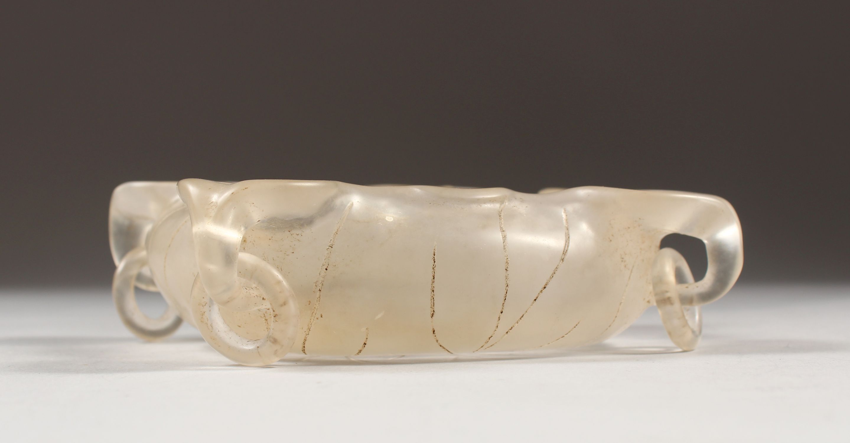 A CHINESE ROCK CRYSTAL WATER POT, with loose ring handles, carved in the form of an open lotus, 3.