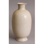 A CHINESE SONG STYLE CREAM GLAZED PORCELAIN VASE, the sides incised with a pair of swimming ducks,