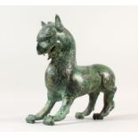 A GOOD CHINESE PATINATED BRONZE MODEL OF A DRAGON, stood in a striking pose, 21.5cm high, 24cm