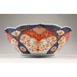 AN EARLY 20TH CENTURY JAPANESE IMARI BARBED PORCELAIN BOWL, the base with an orchid mark, 23.4cm