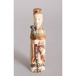 A CHINESE CARVED AND STAINED IVORY FIGURE SNUFF BOTTLE. 10.1cm high.