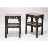 A GOOD PAIR OF CHINESE HARDWOOD STANDS, featuring a single central shelf with a carved apron, each