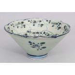 A CHINESE BLUE & WHITE PROVINCIAL BOWL, the base with a stylised seal mark, 14.4cm diameter, 6.9cm