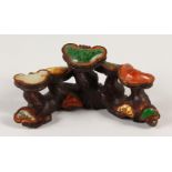 A CHINESE BRONZE AND HARDSTONE BRUSH REST, modelled as fungi. 13cms wide.