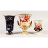 A DERBY TWO-HANDLED CAMPAGNA VASE, painted with flowers, 17cms high, and TWO SPODE VASES, 16cms