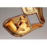A MEERSCHAUM PIPE, young lady in a leather case.