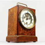 A 19TH CENTURY ROSEWOOD INLAID CLOCK, with white dial, Roman numerals and carrying handle. 18cms