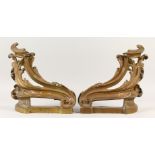 A PAIR OF BRASS ROCOCO STYLE CHENETS. 36cms high.