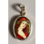 A SILVER OVAL PENDANT, miniature of a young girl.