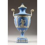 AN ADAMS PALE BLUE JASPER WARE CLASSICAL URN AND COVER. 28cms high.