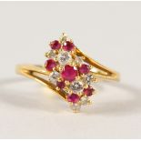 AN 18CT GOLD, DIAMOND AND RUBY RING.