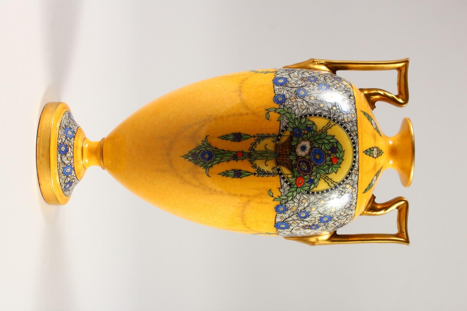 A ROYAL WORCESTER TWO-HANDLED VASE, with yellow ground painted with flowers and garlands. 28cms - Image 3 of 5