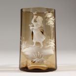 A VICTORIAN MARY GREGORY AMBER TANKARD, CIRCA. 1880, painted with a girl. 3.5ins high.