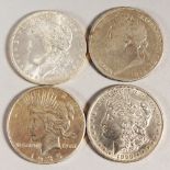 FOUR USA SILVER DOLLARS, 1821, 1893, 1885 and 1935.