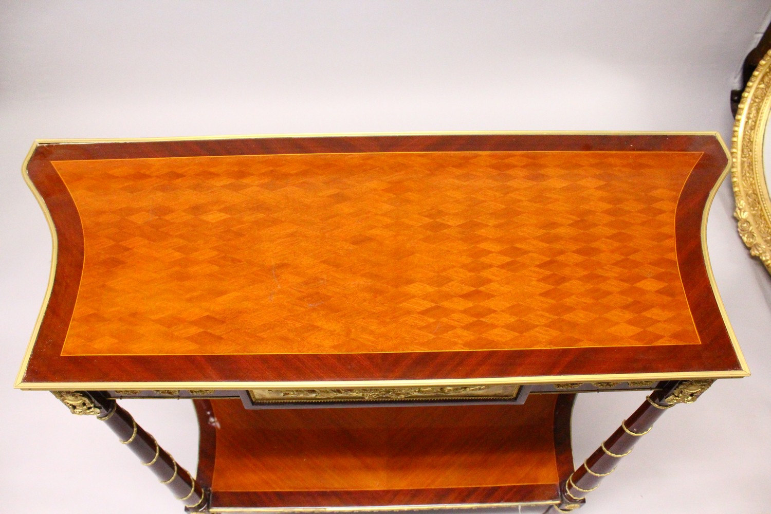 A FRENCH STYLE MAHOGANY AND ORMOLU TWO-TIER SIDE TABLE, with turned column supports. 104cms wide x - Image 2 of 4