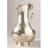 A GOOD VICTORIAN SILVER ENGRAVED WATER JUG with acanthus handle. 28cms high. London 1856. Maker: R.