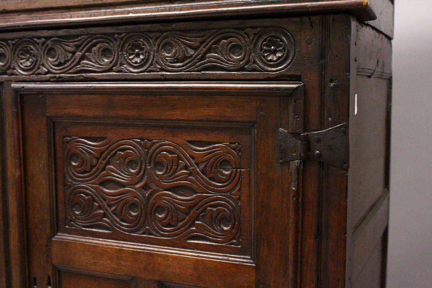 A 17TH/18TH CENTURY OAK COURT CUPBOARD, with carved frieze over two carved central panels flanked by - Image 2 of 10