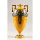 A ROYAL WORCESTER TWO-HANDLED VASE, with yellow ground painted with flowers and garlands. 28cms
