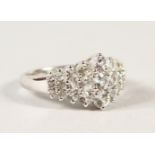 A 14CT WHITE GOLD WHITE SAPPHIRE CLUSTER RING of 1.8cts approx.