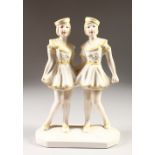 AN ART DECO DESIGN YELLOW AND WHITE GROUP OF TWO GIRLS. 12ins high.