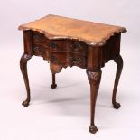 AN 18TH CENTURY DESIGN WALNUT TWO DRAWER SIDE TABLE, of shaped outline, the two drawers with