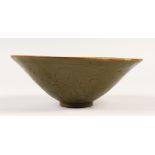 A CHINESE CELADON PORCELAIN BOWL, with incised decoration. 18cms diameter.