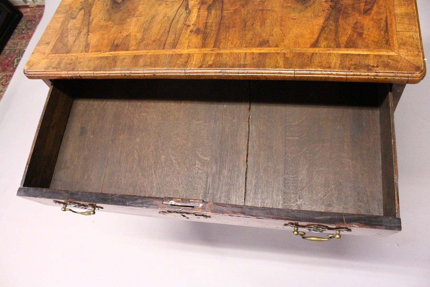 AN 18TH CENTURY WALNUT KNEEHOLE DESK, with quarter veneered top, one frieze drawer, a central - Image 11 of 17