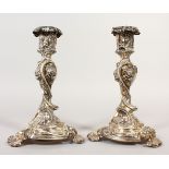 A PAIR OF ROCOCO STYLE CANDLESTICKS. 20cms high.