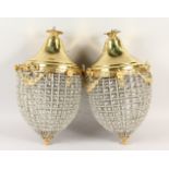 A PAIR OF PINEAPPLE SHAPE CUT GLASS AND BRASS HANGING LANTERNS. 60cms high.
