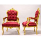 A PAIR OF FRENCH STYLE GILTWOOD ARMCHAIRS, with classical style maroon upholstery.