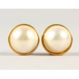 A PAIR OF BAROQUE PEARL EAR STUDS.